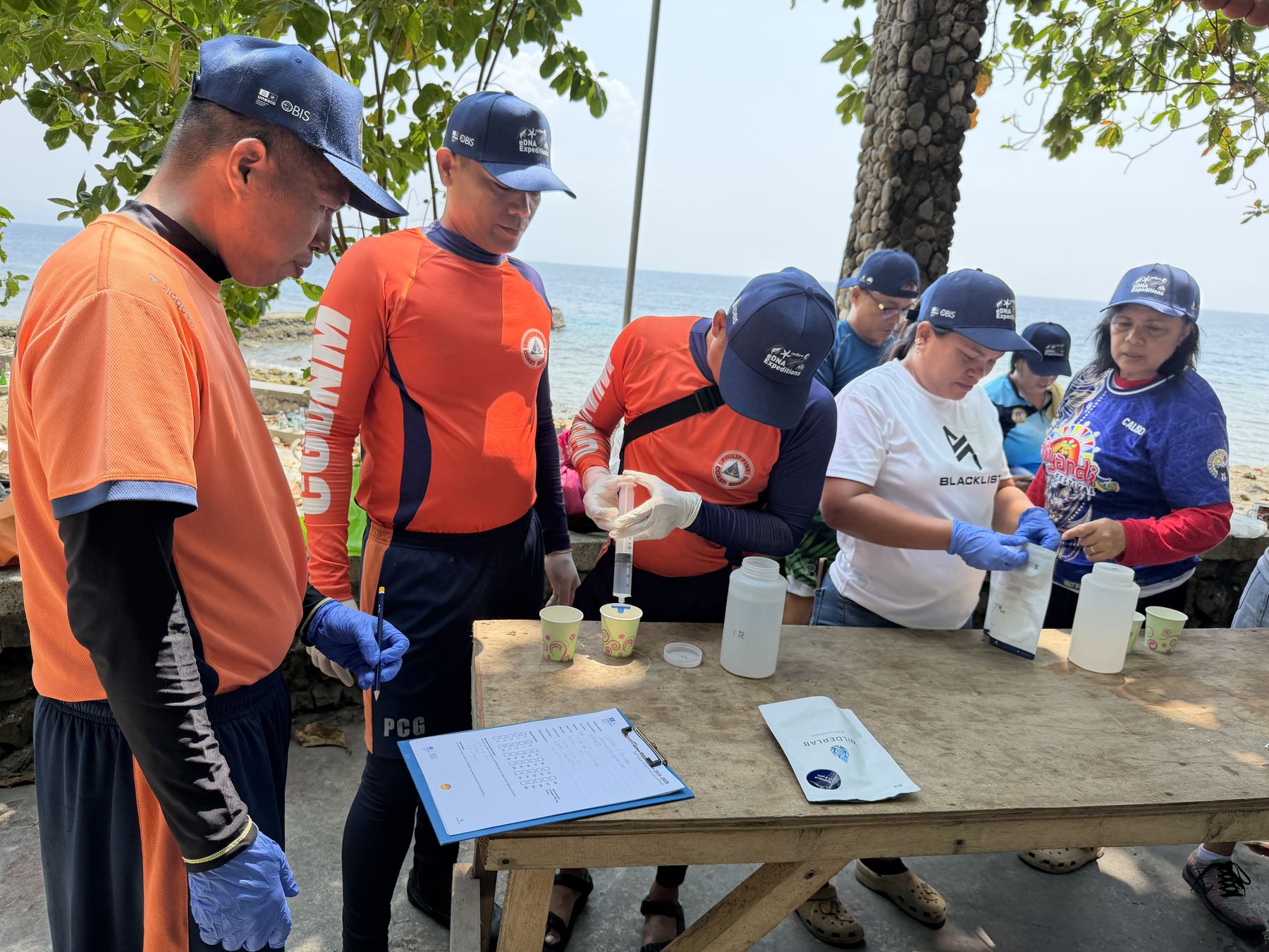 Coast Guard and volunteers taking part in a citizen science sampling event at the Dalipuga Marine Protected Area. Iligan Bay, Philippines, September 2026.